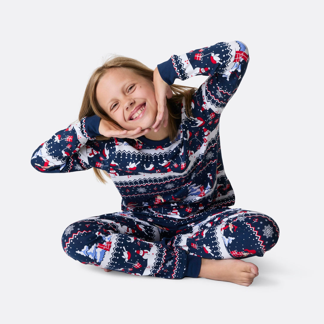 Kerstlandschap Kerstpyjama's Gezin